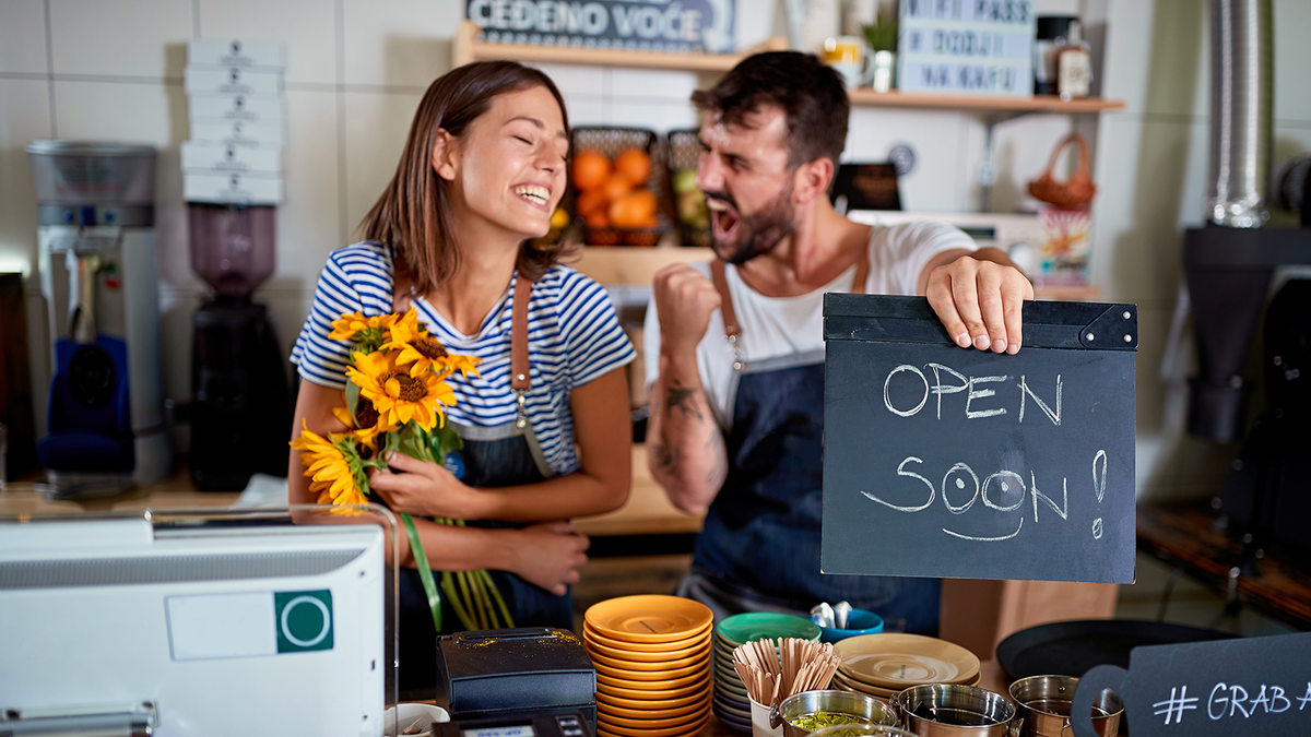 Business owners preparing to open a new storefront before launch