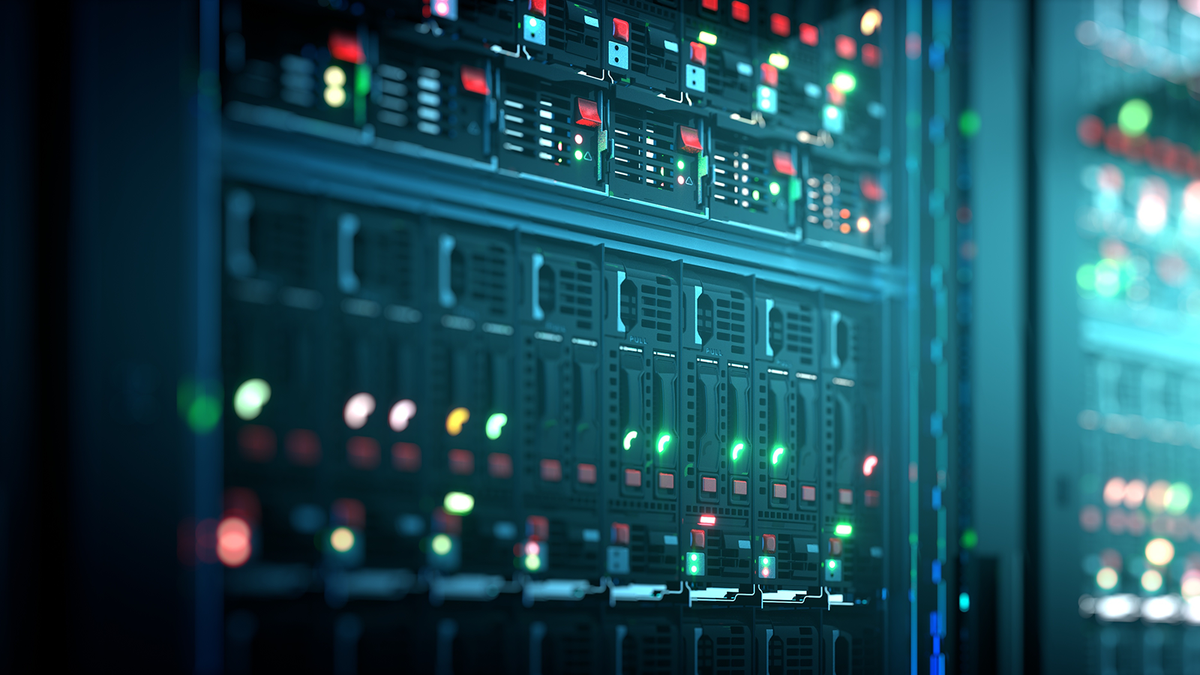Close-up of server racks with illuminated status lights in a data center.