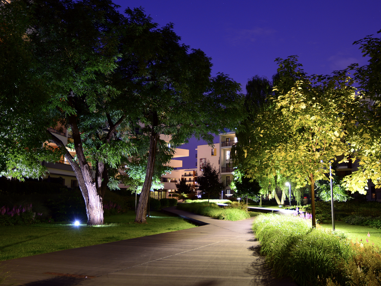 Residential property at night monitored by a Hawk security camera with night vision.
