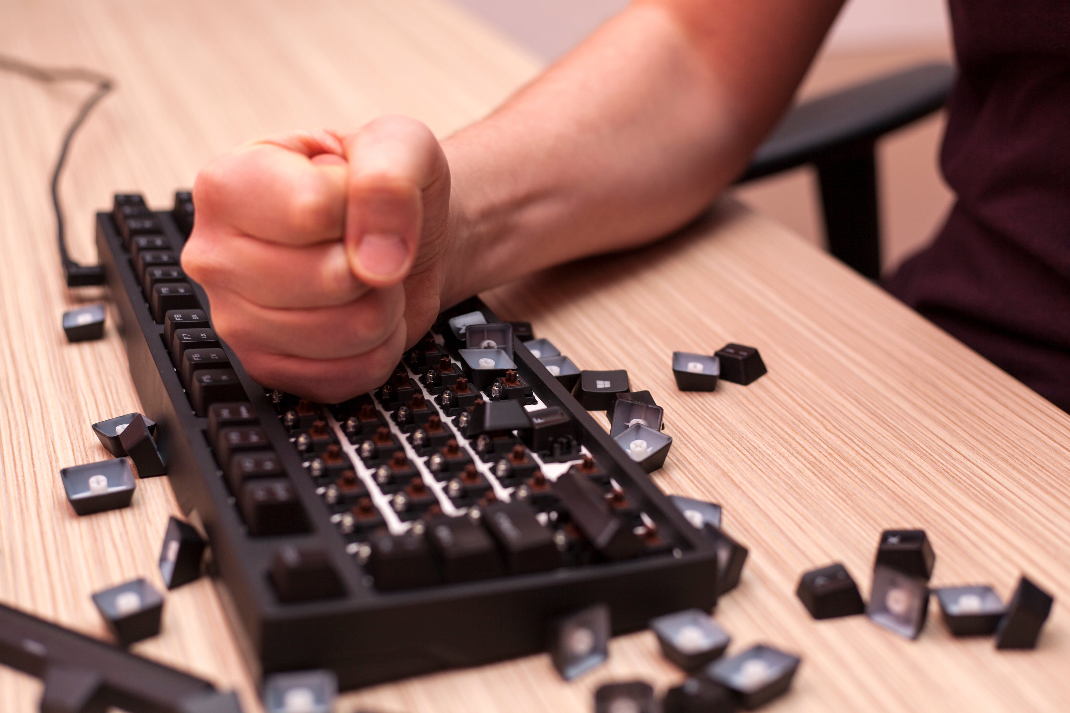 Frustrated office worker reacting to technology issues, representing the challenges businesses face with unreliable connectivity.