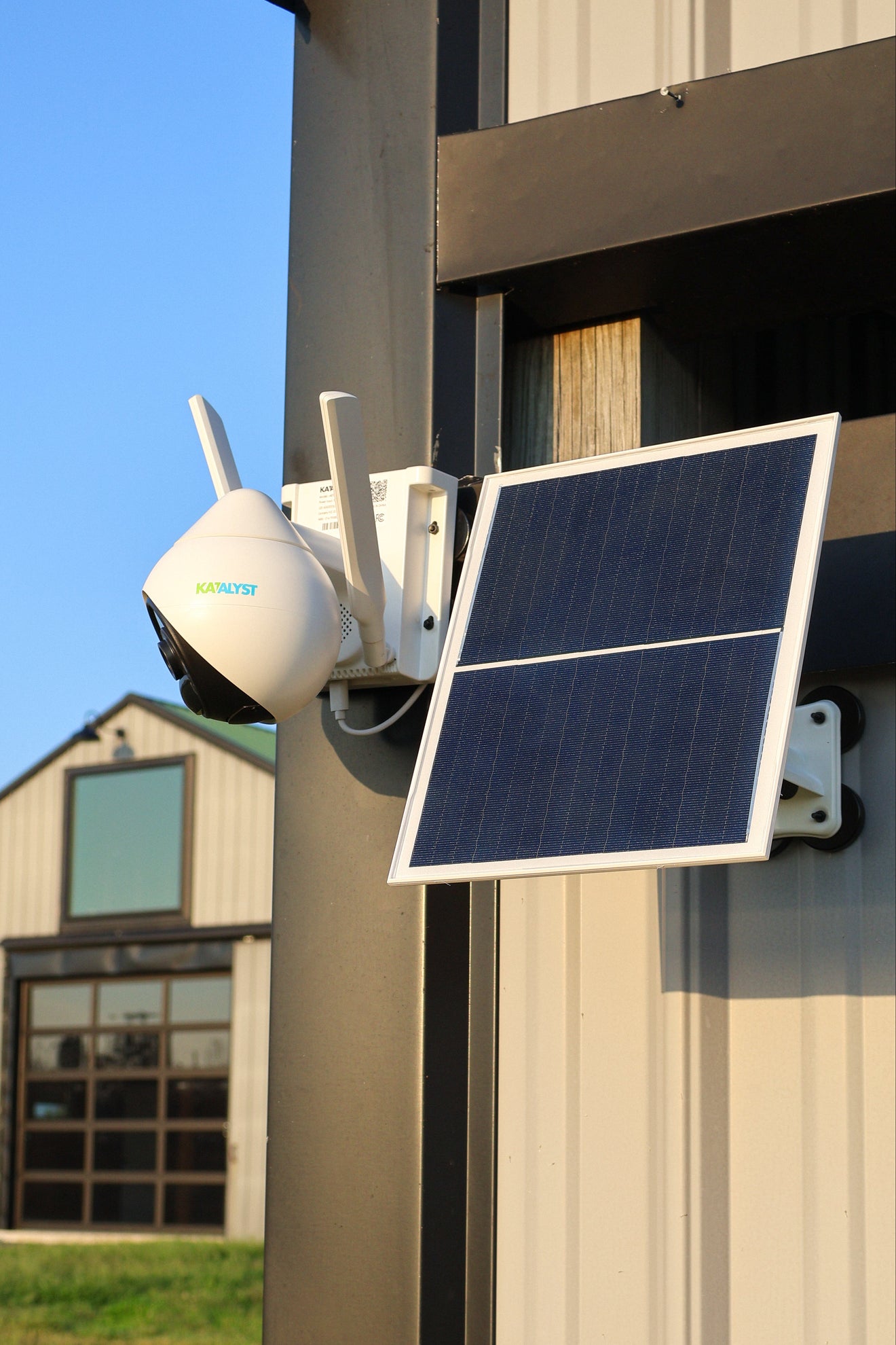 Katalyst Hawk C401B 4G outdoor camera with solar panel mounted on a building.