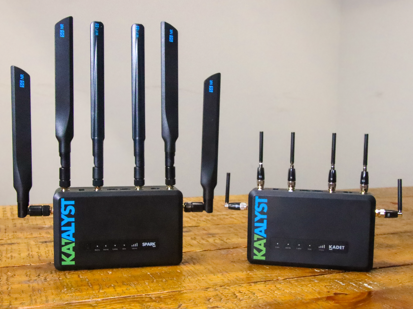 Comparison of standard and Mini-R cellular antennas installed on Katalyst routers, highlighting compact design and high-performance connectivity.