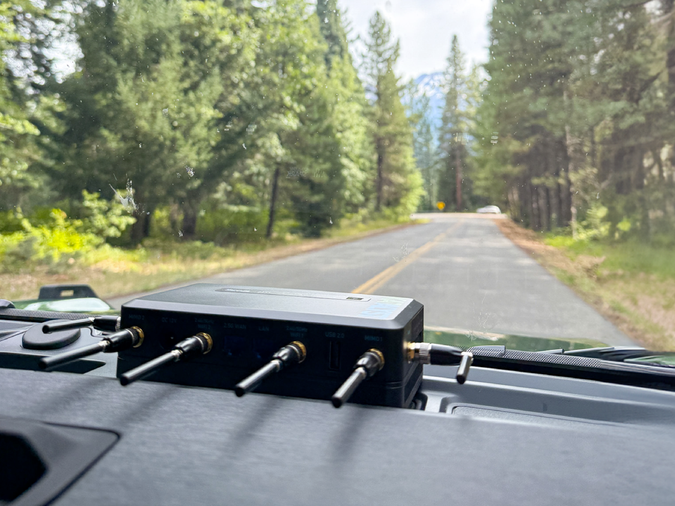 Mini-R omni-directional cellular antennas installed on a router inside a vehicle for reliable connectivity on the move.