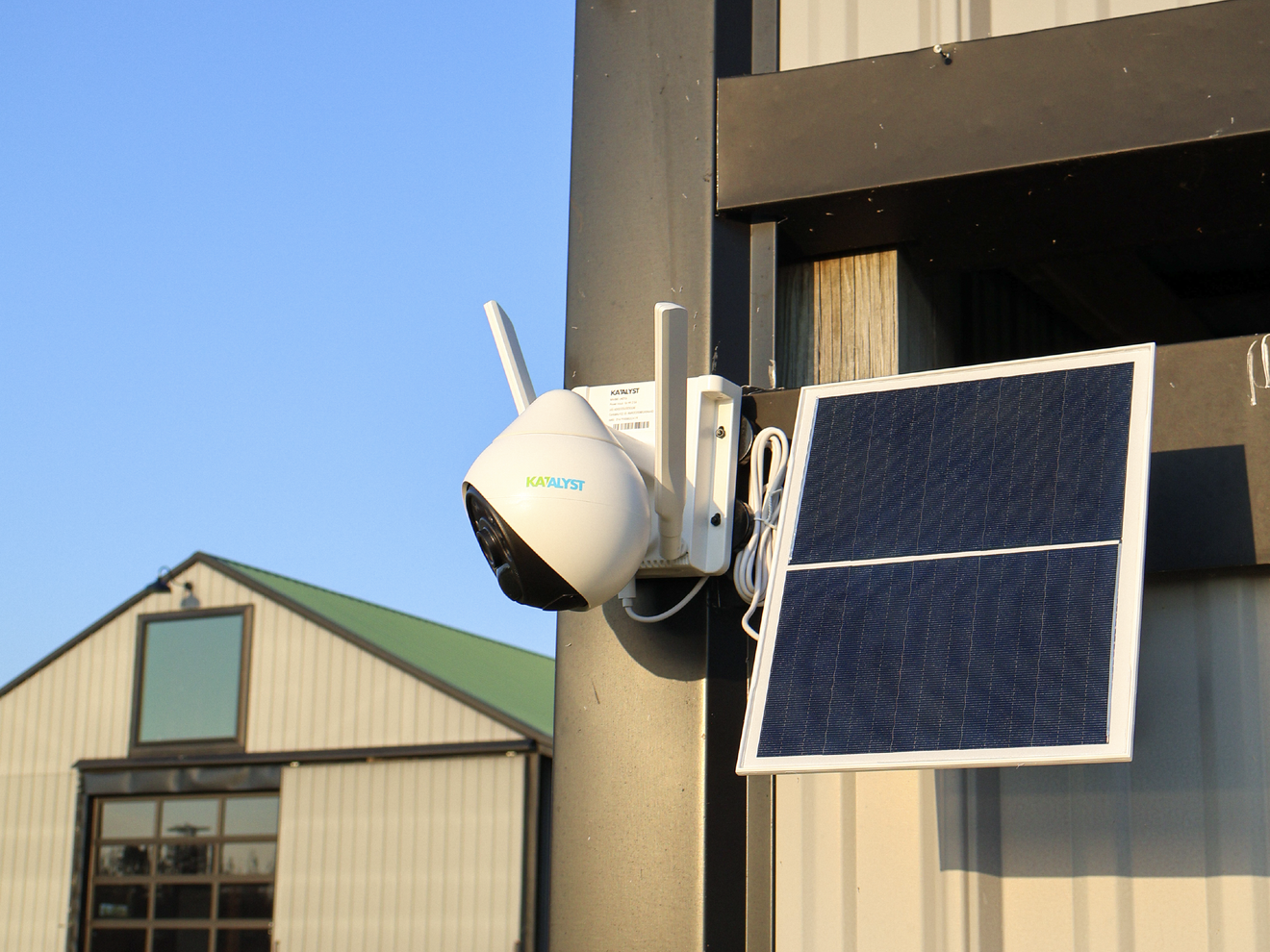 Hawk solar-powered security camera mounted outdoors with an attached solar panel for continuous operation.
