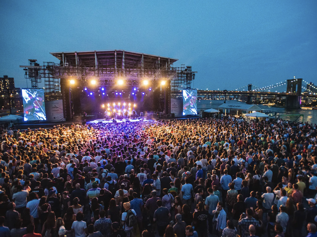 Outdoor concert with large crowd relying on cellular internet for event operations and connectivity