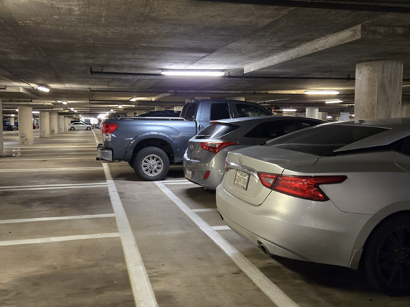 Parking garage monitored by Hawk security cameras for vehicle and property surveillance.