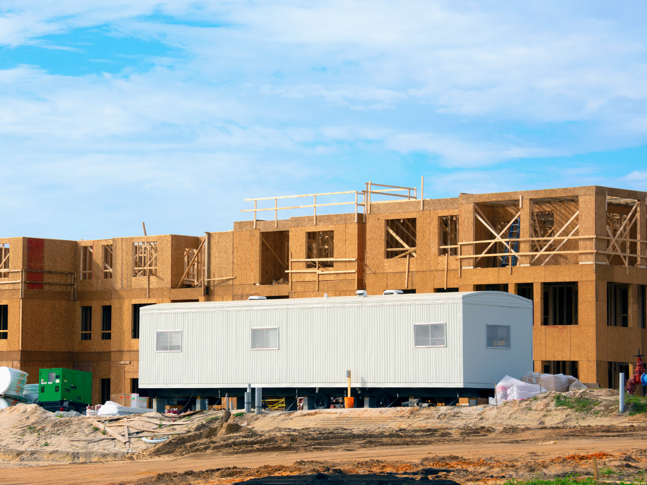 Construction site trailer using cellular connectivity to remotely monitor equipment, cameras, and job site operations.