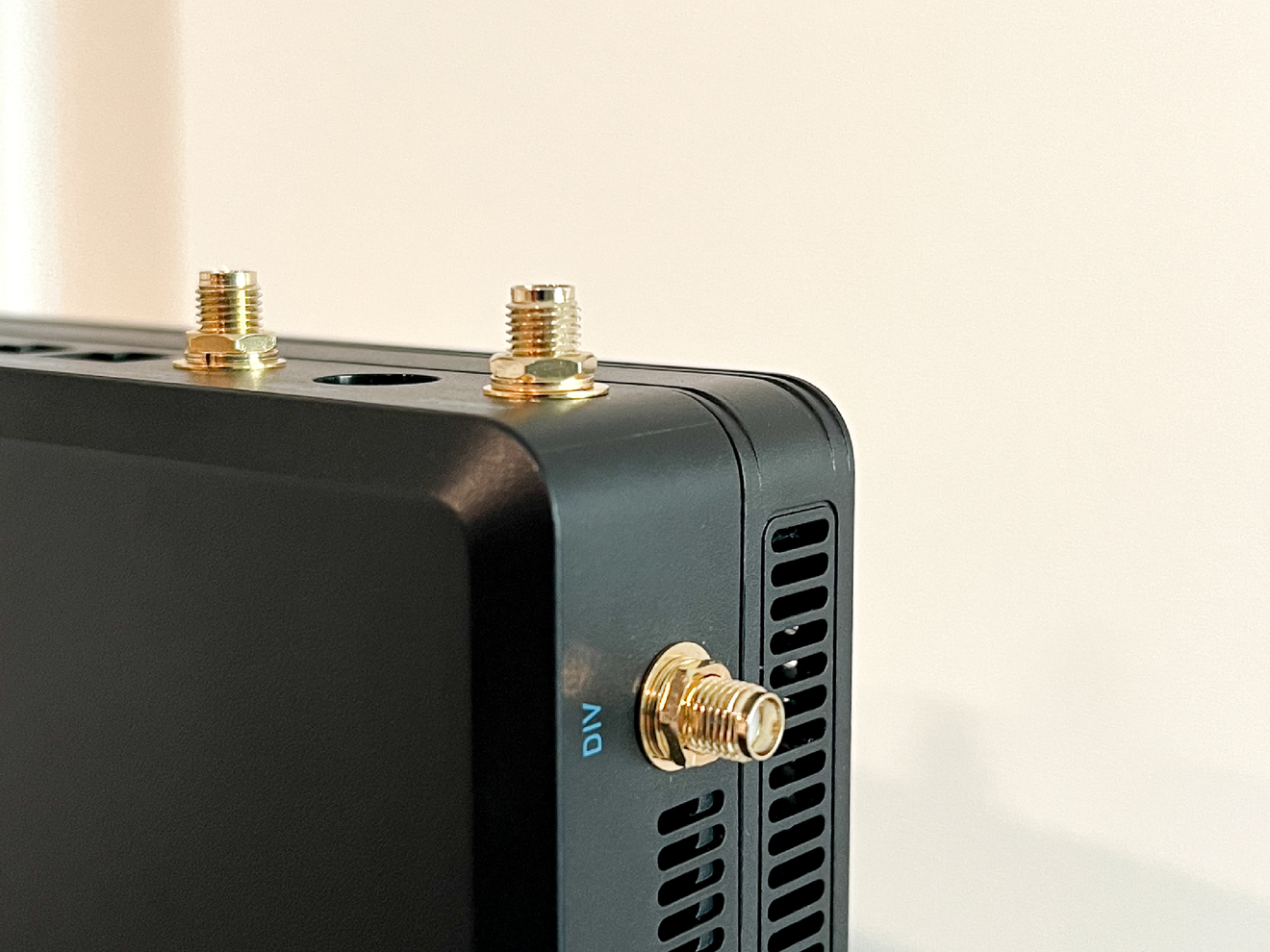 Cellular router with external antenna ports ready for Mini-R antenna installation.